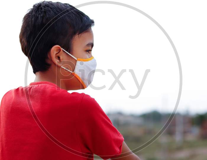 Little Indian Cute Boy Wearing Mask During Corona Virus And Flu Outbreak. Mask For Corona Virus Prevention.