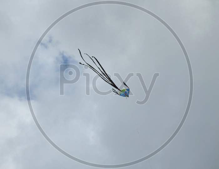 Image of Colorful Kites Flying On The Wind In Bangalore City With