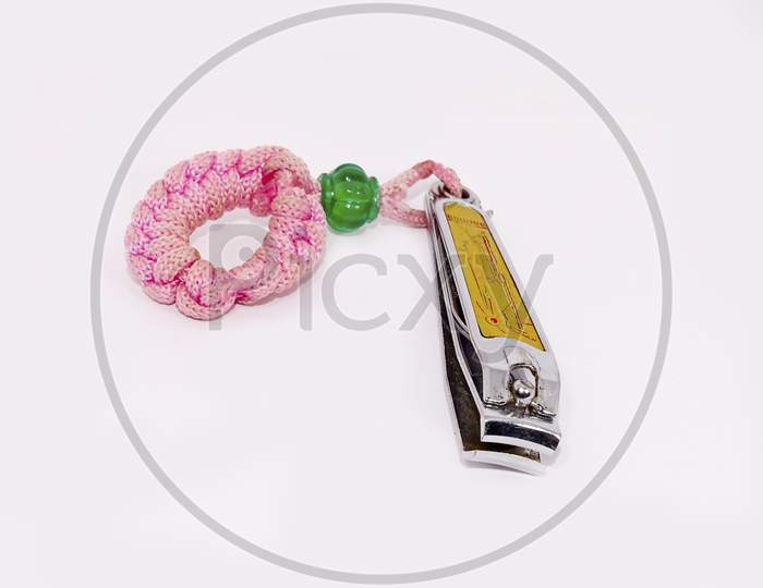 Stainless steel nail clippers isolated on white background.