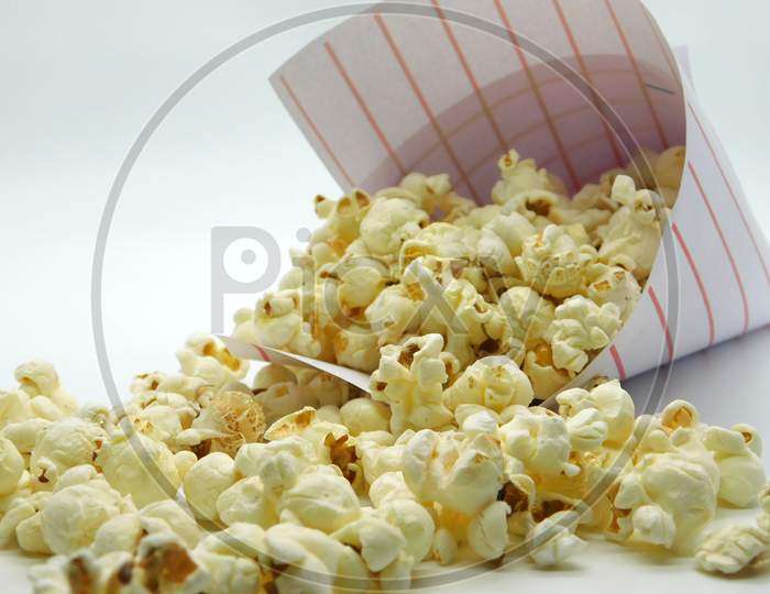 Packed Of Popcorn Spilled On Isolated White Background