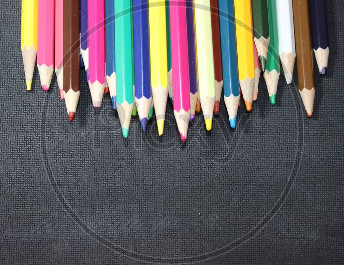Bright Colored Multicolor Pencils On Black Background