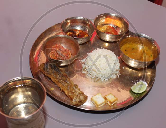 Traditional Bengali fish Thali for a baby's rice eating ceremony in Bengal along with the other Bengali ritual Thali made for this occasion, which is also called"Annaprasan".