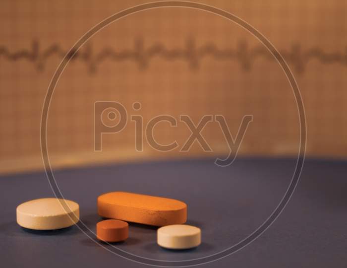 Numerous Colored Pills On Neutral Background. Medicines For Use In Humans.