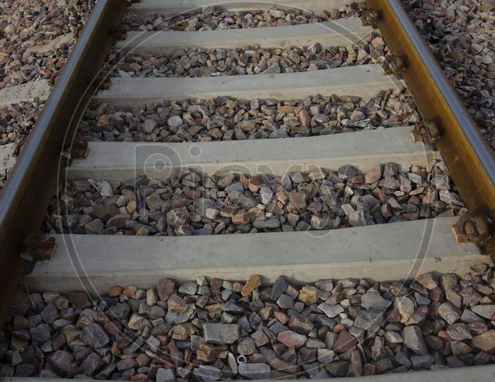 Selective focus on RAILWAY TRACK WITH STONES for transportation. Train track.