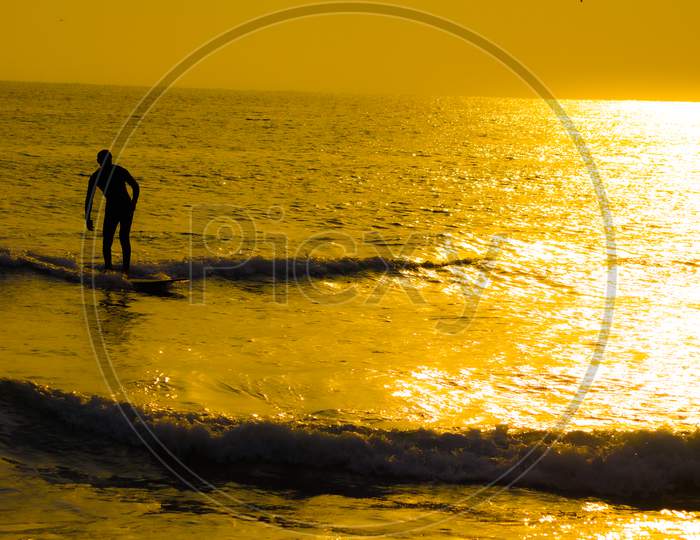 Surfer Silhouette And Dusk Of Kamakura Coast