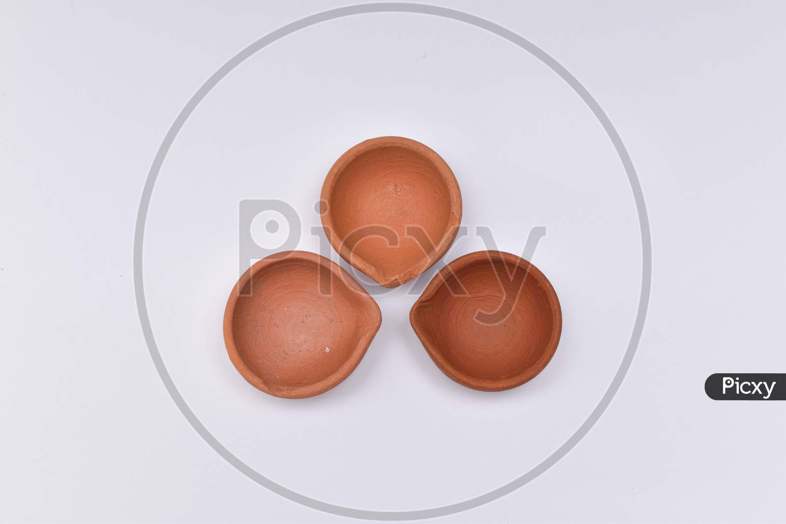 Closeup Shot Of Three Diyas Or Oil Lamp For Diwali With White Background