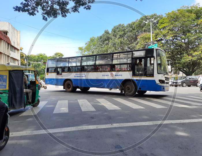 Closeup Of Bmtc Blue Bus Crossing The Road Of Netkallappa Circle, Near Basavanagudi Police Station, Kr Market Main Road