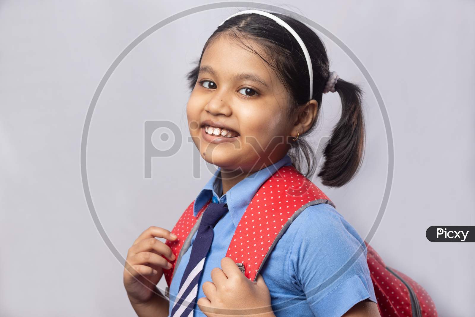 Smiling Girl Child In School Uniform
