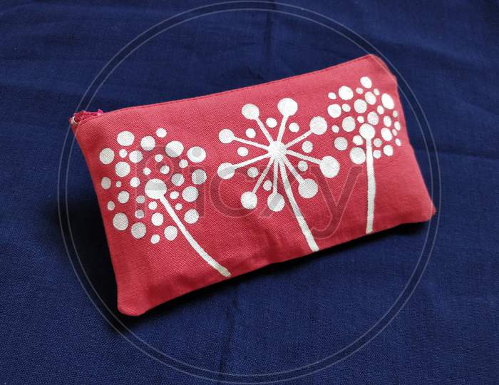 Canvas pink color pouch white dandelion flower painting, canvas pouch and cosmetic bag, handmade, hand painted, handcrafted cotton fabric color painting on blue background texture