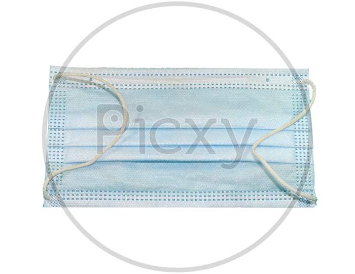 Medical mask isolated on a white background .
