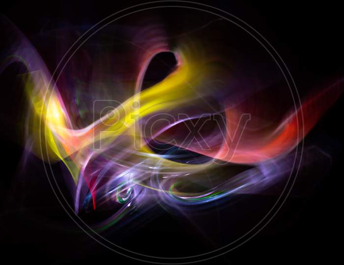 Light-Painting Photography. Colored Lights Forming Abstract Shapes On A Black Background.