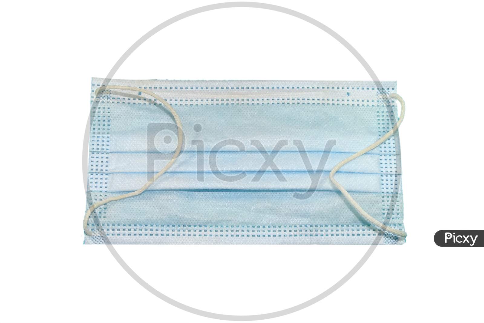 Medical mask isolated on a white background .
