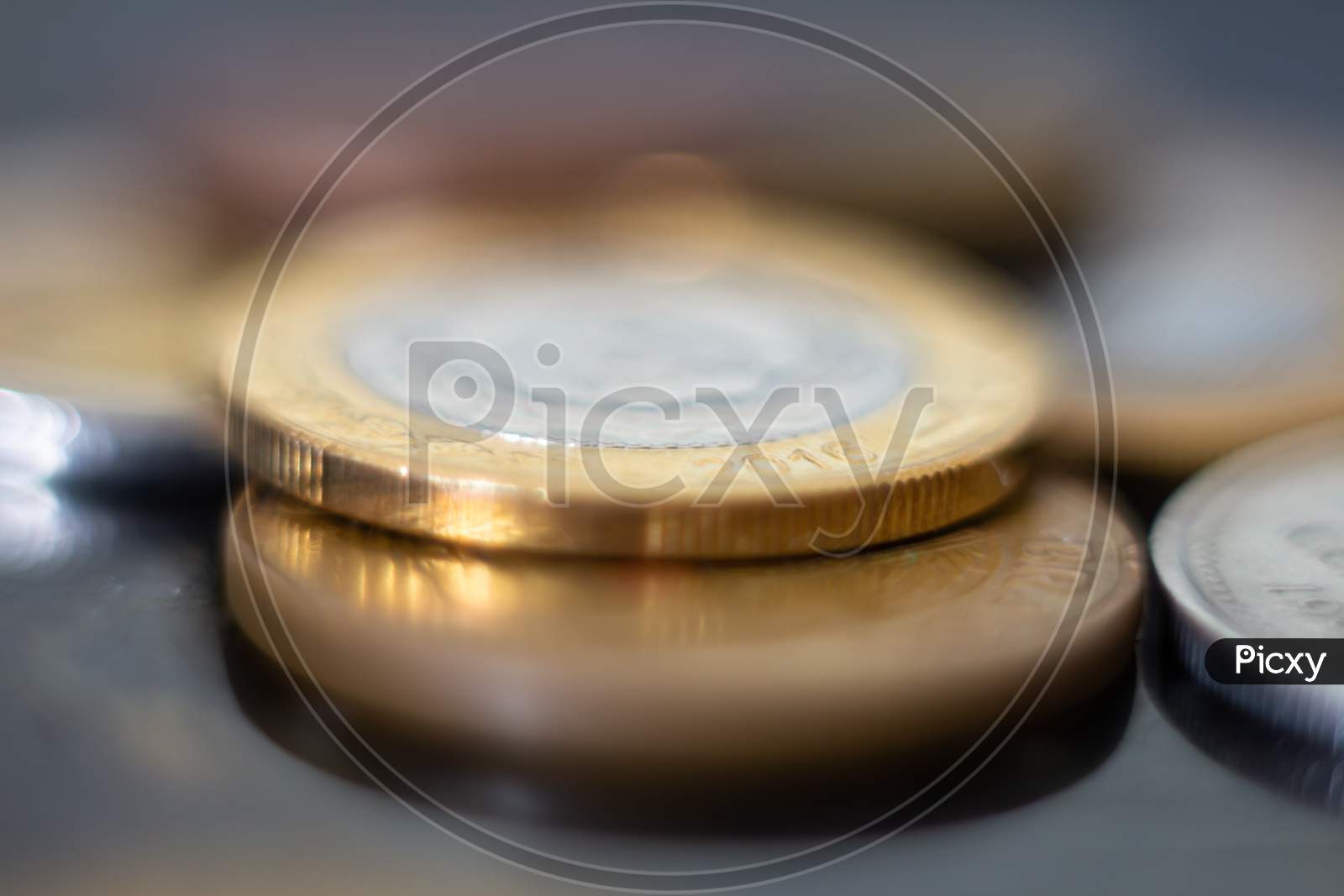Closeup To Silver And Gold Coins. Physical Money In Metal Called Coins. Savings And Wealth Concept.