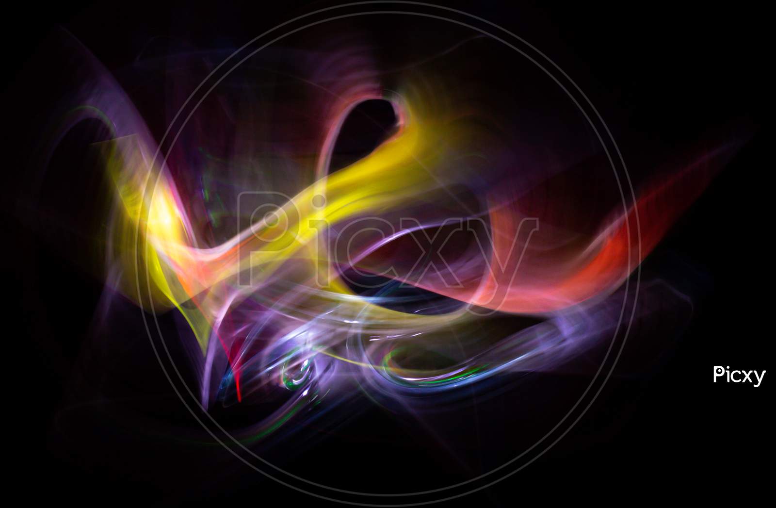 Light-Painting Photography. Colored Lights Forming Abstract Shapes On A Black Background.