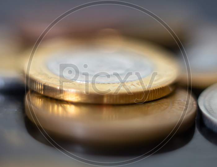 Closeup To Silver And Gold Coins. Physical Money In Metal Called Coins. Savings And Wealth Concept.