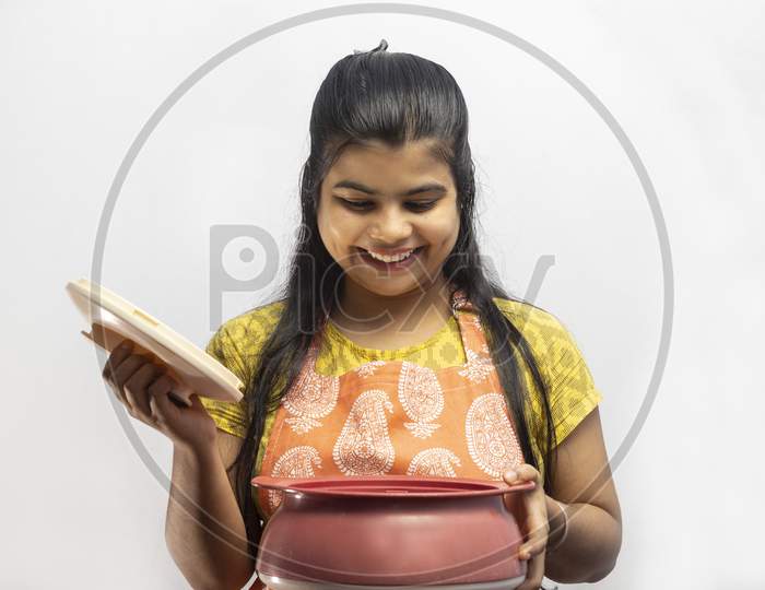 Indian Housewife In Kitchen