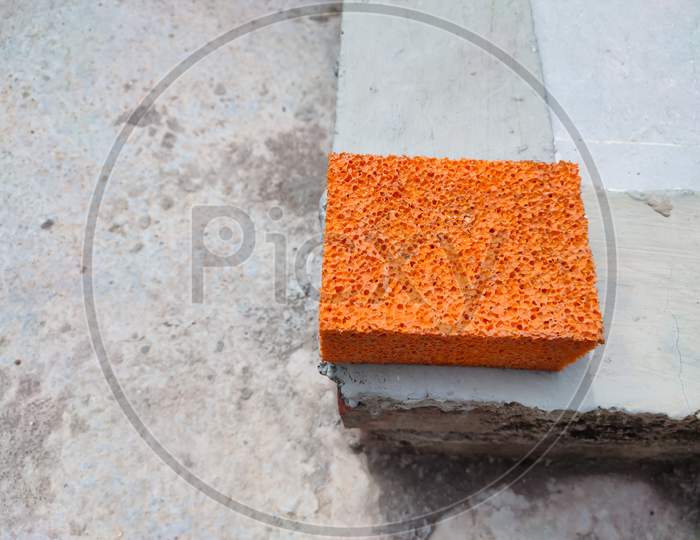 Orange sponge detail texture. Top view