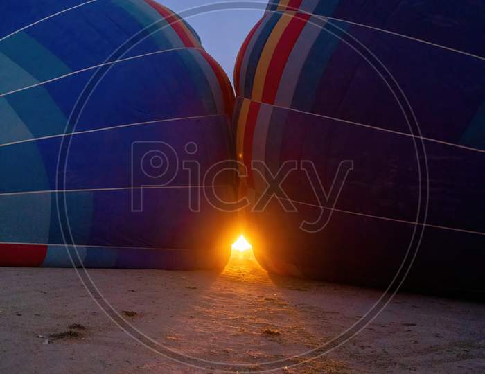 A Fire Being Filled Into The Hot Air Balloons Or A Newly Inflated Balloon In The Morning Darkness At The Cappadocia In Turkey