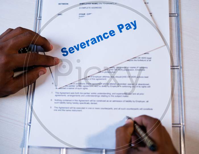 Pov Shot Of Employee Checking Severance Pay Notice And Signing On Termination Agreement Or Contract - Concept Of Job Loss During Coronavirus Covid-19 Pandemic