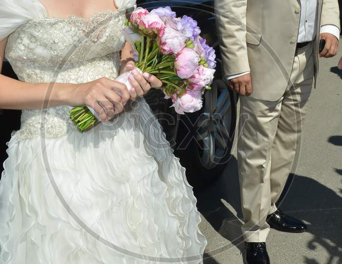 Wedding Bride Holding A Pink Flower Bouquet Outdoor