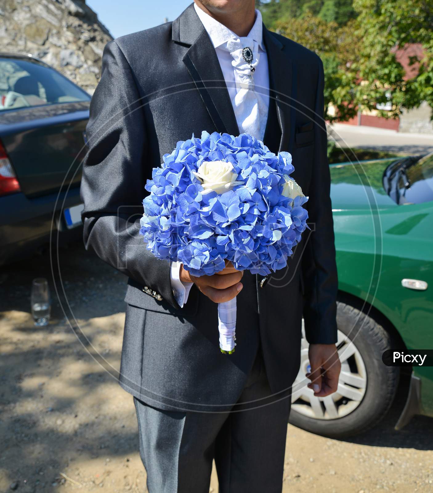 Groom Holding A Blue Flower Bouquet Outdoor