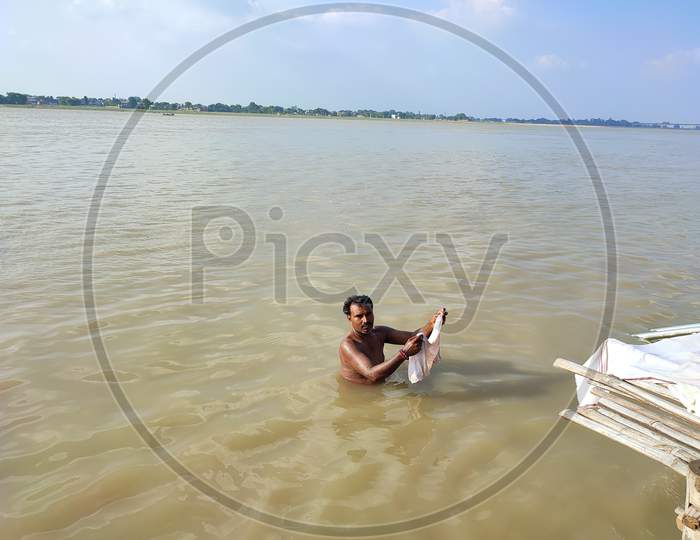Ganges river man bathing.