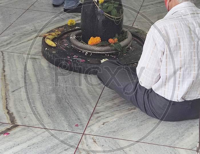 indian old man in shiva temple
