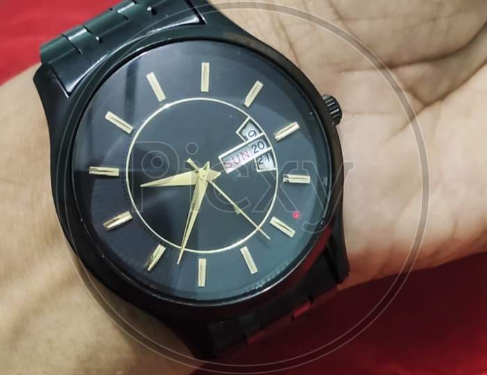 black analog watch for men and hand is watch close up photo image
