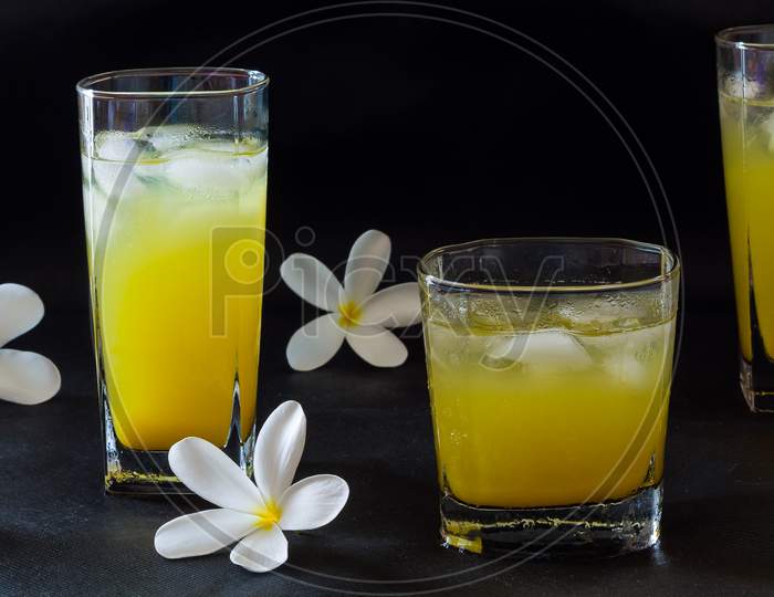 Front view of orange juice isolated on black background. Fresh,sweet fruit juice.