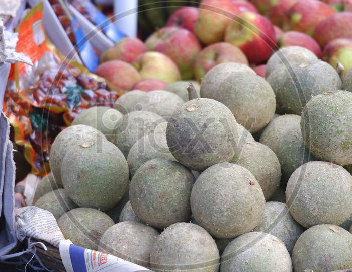 Close Image Of Wood Apple Red Apple Being Sold On Road In India.