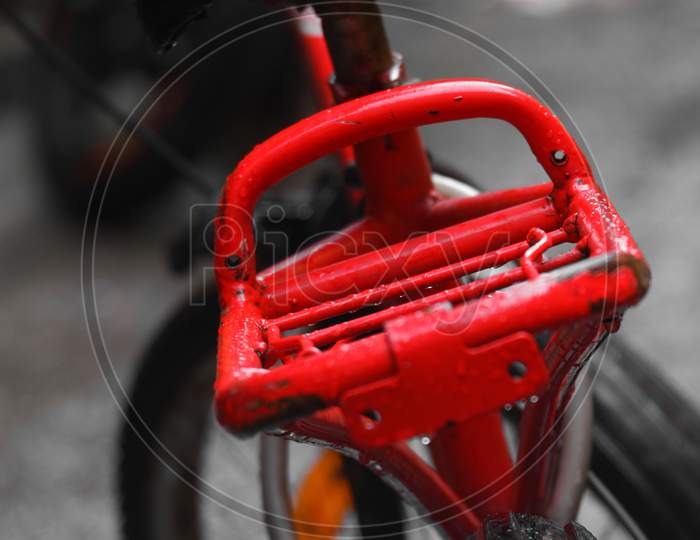 Isolated Close Up Image Of Red Carrier Of A Bicycle.