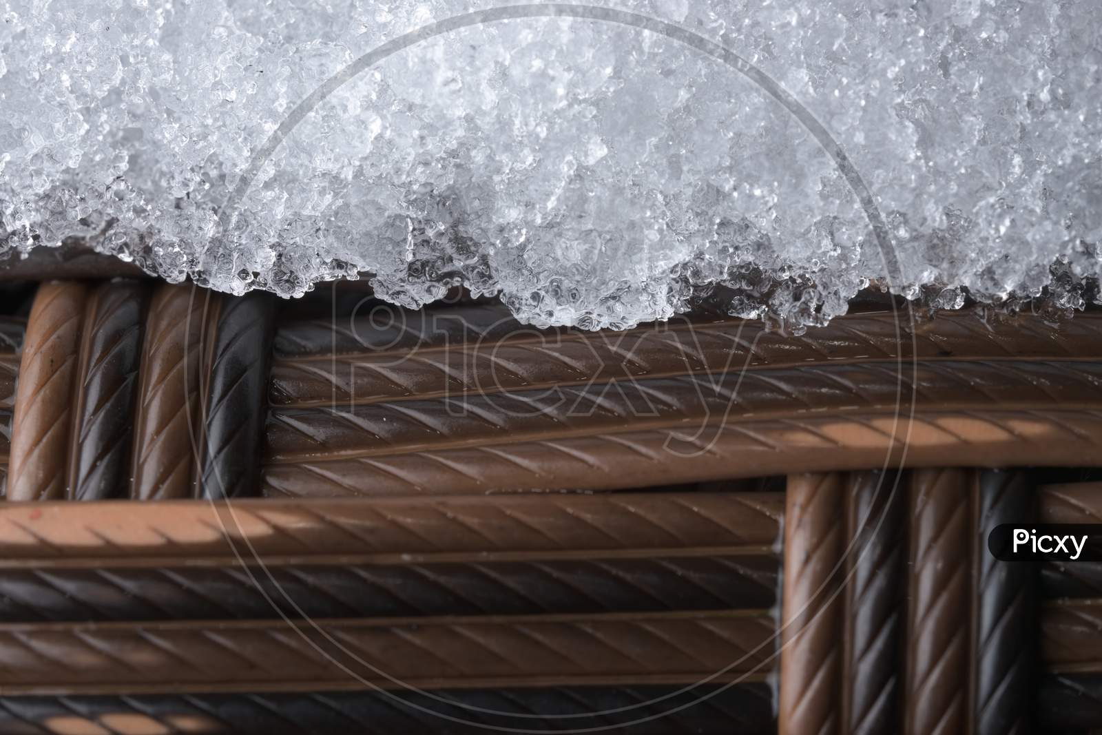 Icy Plastic Garden Furniture. Rattan Style Weave, But Synthetic Material.
