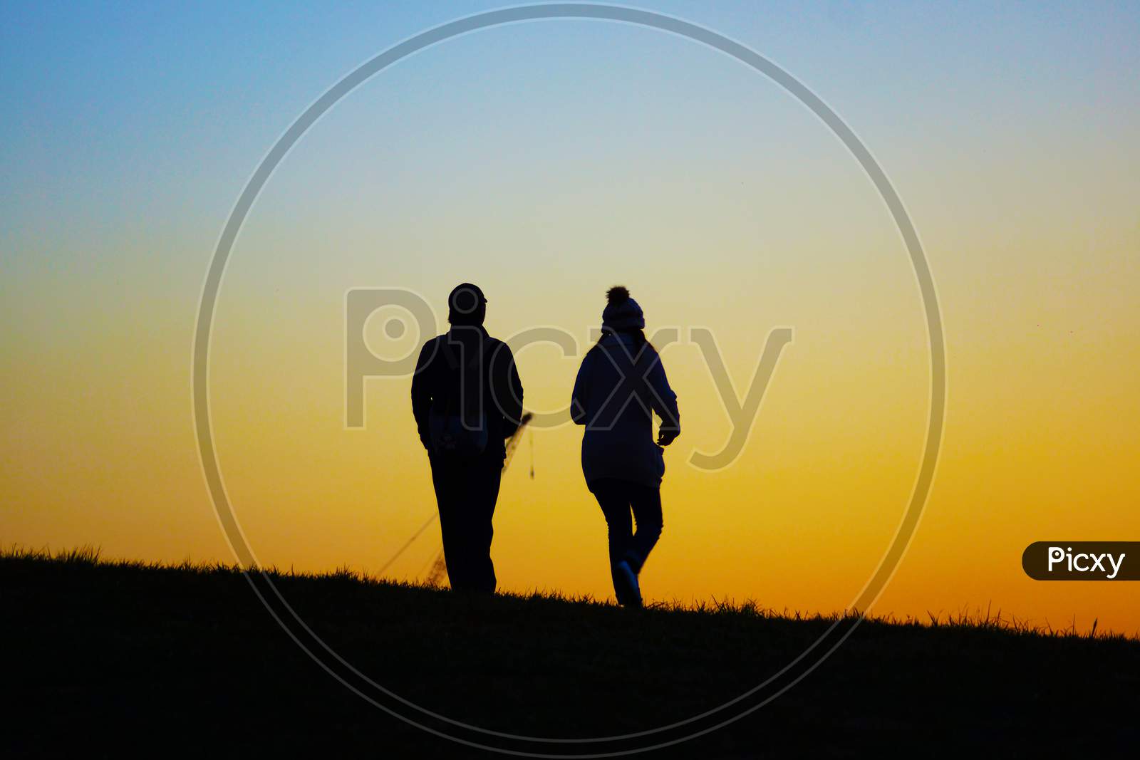 Two People To Walk The Evening Of The Hill
