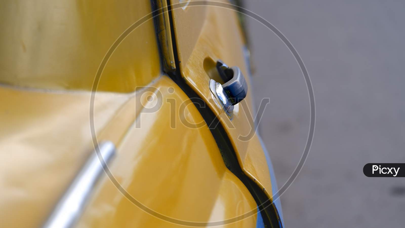 Close Up Image Of Black Door Handle Of Famous Yellow Taxi In Kolkata.
