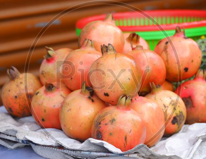 Close Image Of Fresh Pomegranate Being Sold On Road In India.