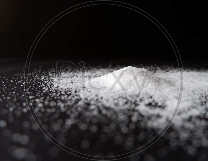 Heap of salt on a black background