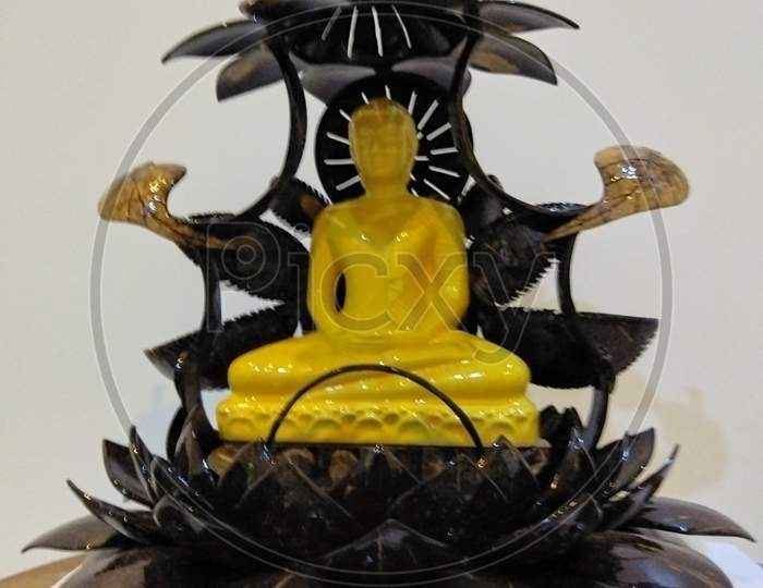 Buddha statue cover with coconut shell