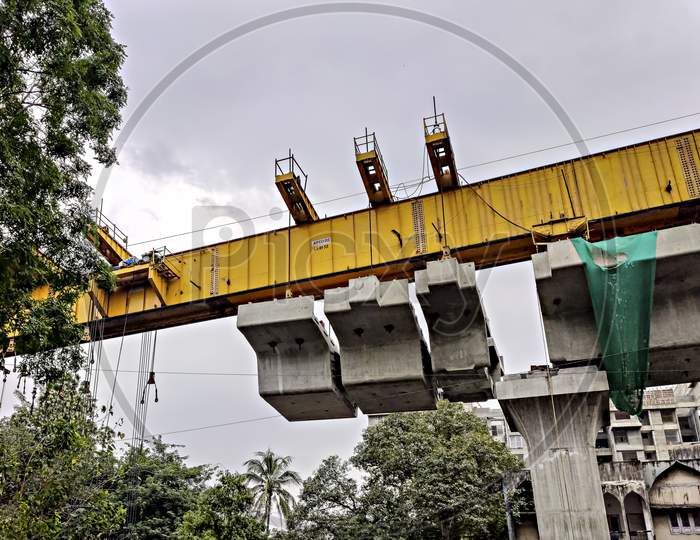 Pune, India - October 3rd, 2019: Girder work of Pune city Metro train line building in progress.