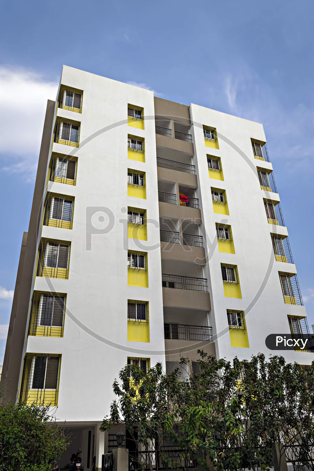 Modern multi-storied residential building with nice beautiful blue sky background.