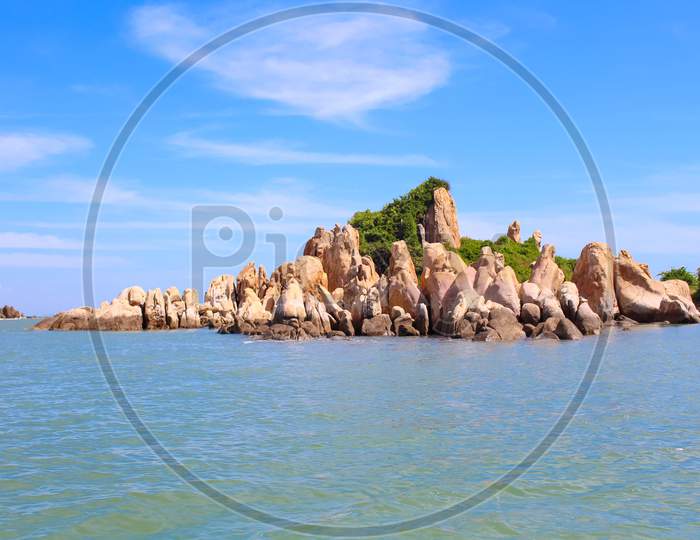 Rocky Beach On The Island Has Ke Ga Lighthouse In Binh Thuan, Vietnam