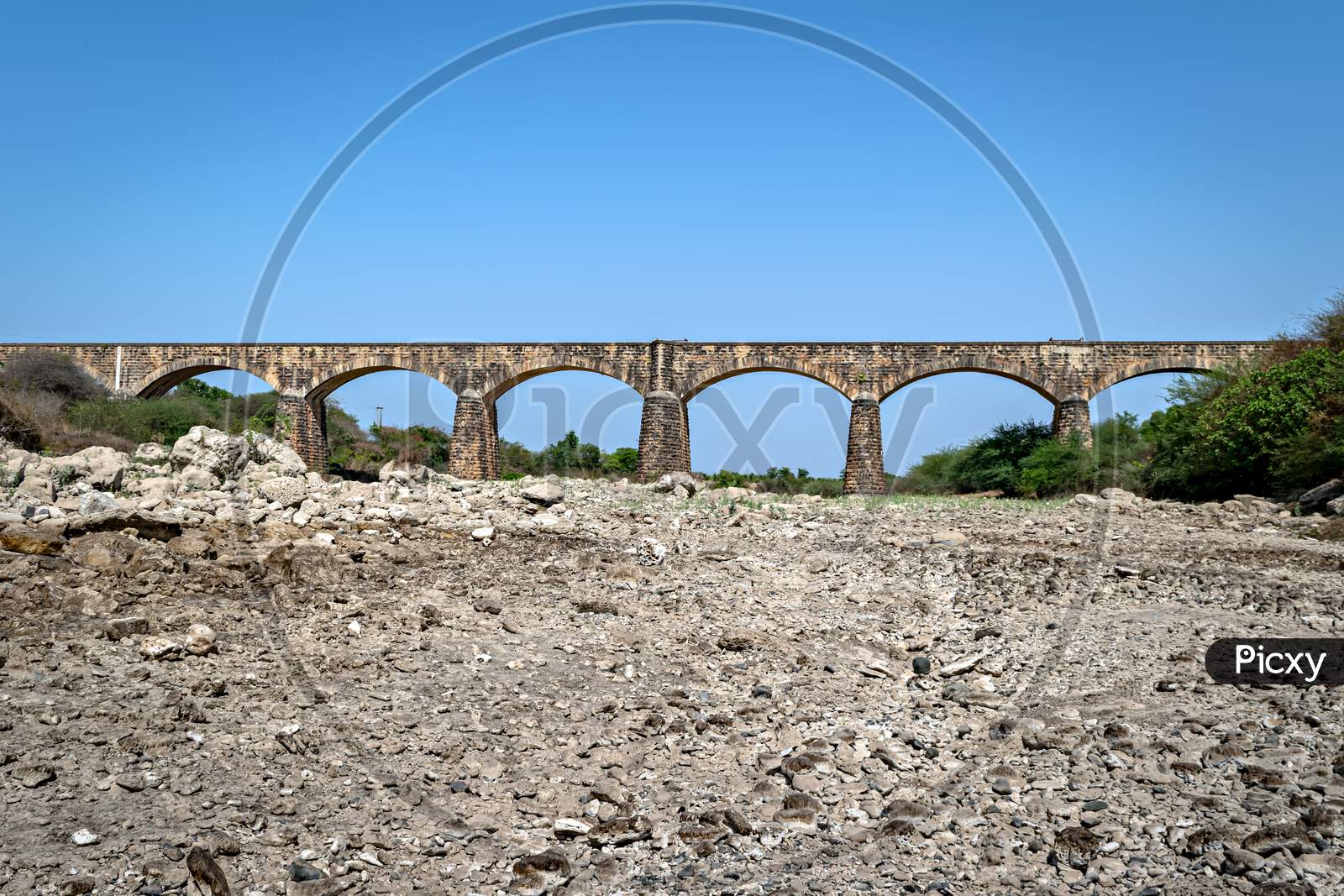 Old , Ancient Meter Gauge Stone Arched Railway Bridge In Bherala, Gujrat, India.