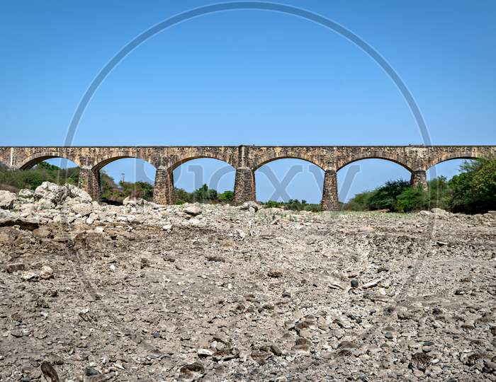 Old , Ancient Meter Gauge Stone Arched Railway Bridge In Bherala, Gujrat, India.