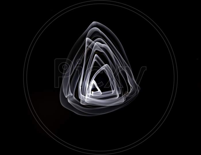 Unique, Long Exposure, White Led Light Painting Photograph Of Abstract Pattern On Black Background.