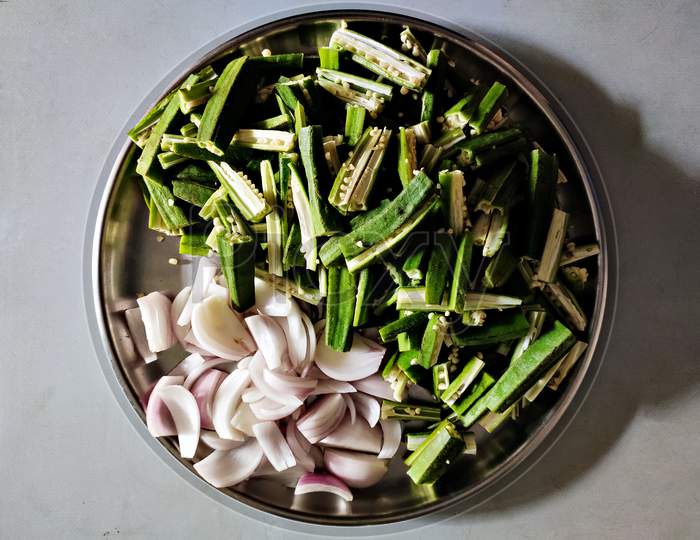 Freshly Cut Vegetables Arranged In A Plate For Dinning Preparations In Home.