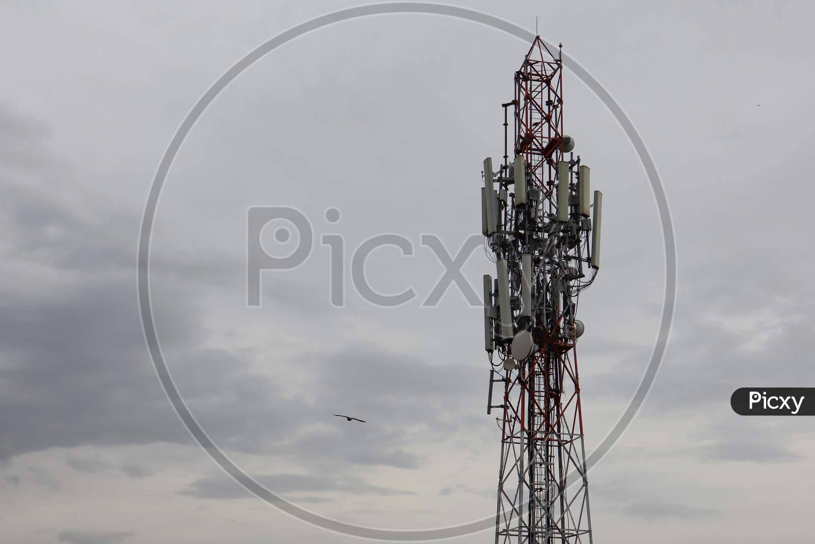 Mobile telecommunication tower or cell tower with antennae and electronic communications equipments.