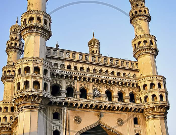Close up image of Charminar with a clear blue sky background in Hyderabad.