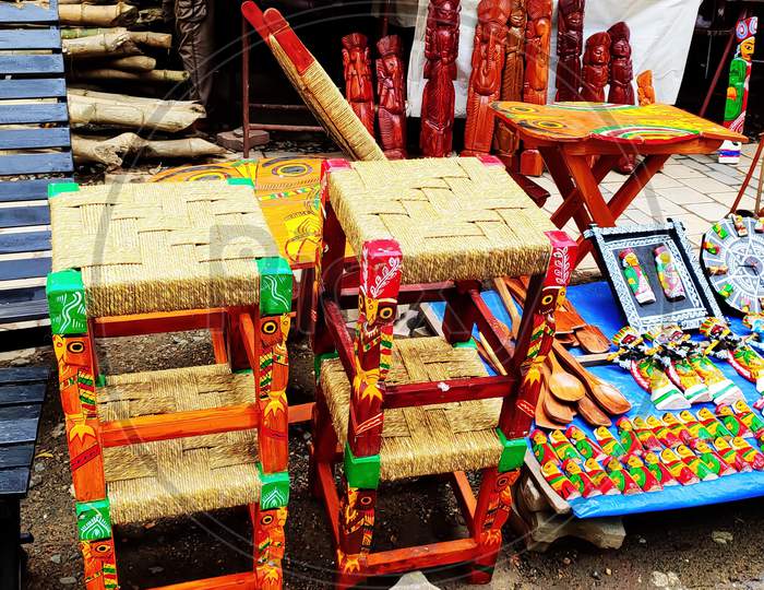 Colorful wooden handcrafted items being displayed on the street in Kolkata, India. Focus on subject.