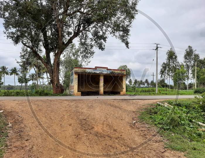 Closeup Of Indian Village Or Rural Bus Stop Shelter In A Roadside Of The Agriculture Field With Nature Background