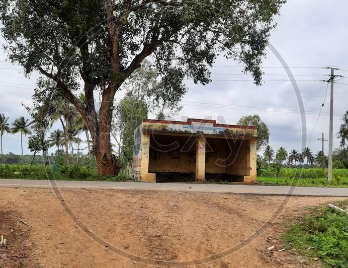 Closeup Of Indian Village Or Rural Bus Stop Shelter In A Roadside Of The Agriculture Field With Nature Background