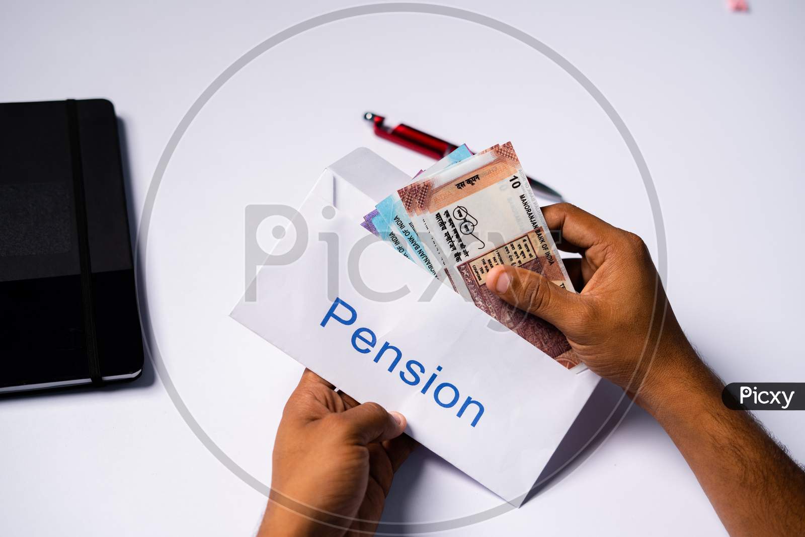 Shoulder Shot Of Man Opening Received Pension Money From Envelope - Concept Of Retirement Pension Payments And Savings.
